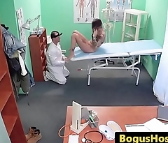 Uniformed doctor exams patients wet pussy