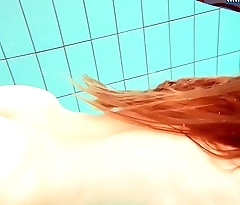 Hot Cheer up redhead swimming in the pool